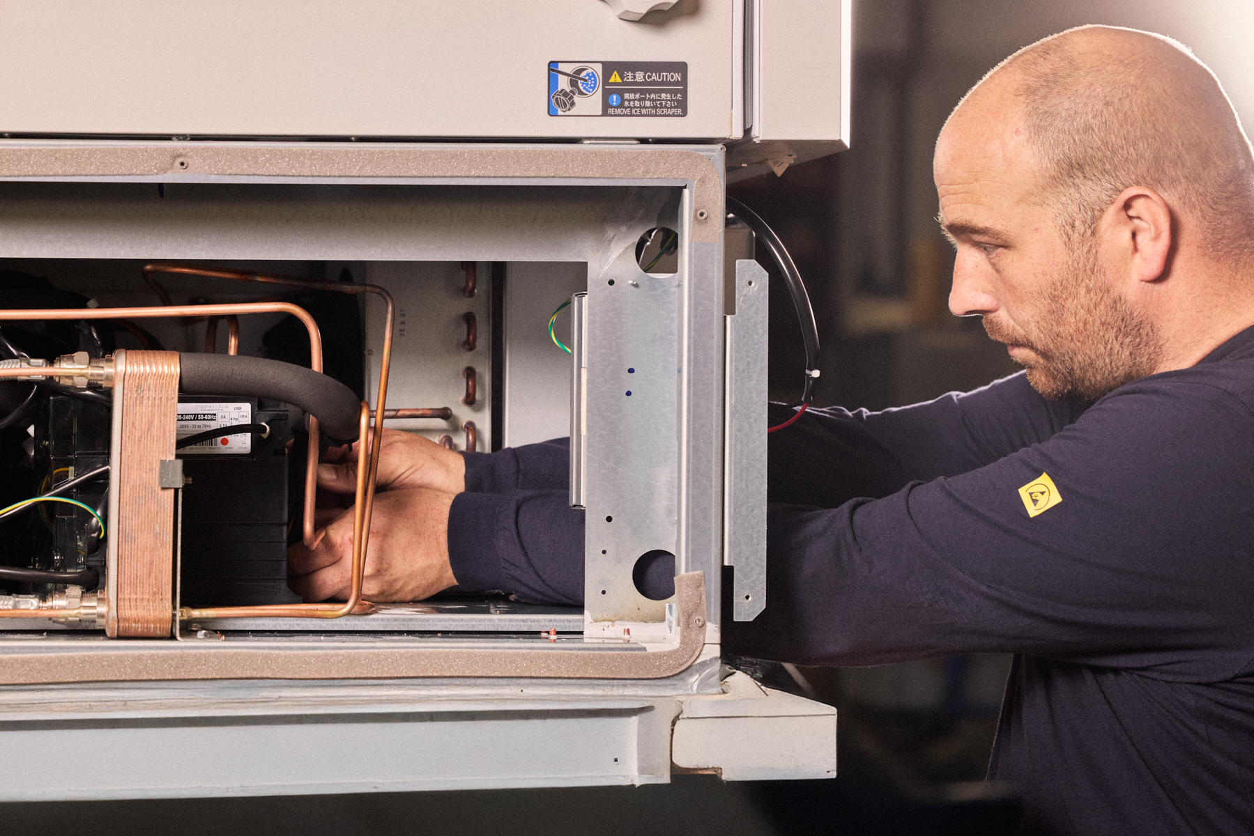 Qualified service engineer calibrating biomedical equipment